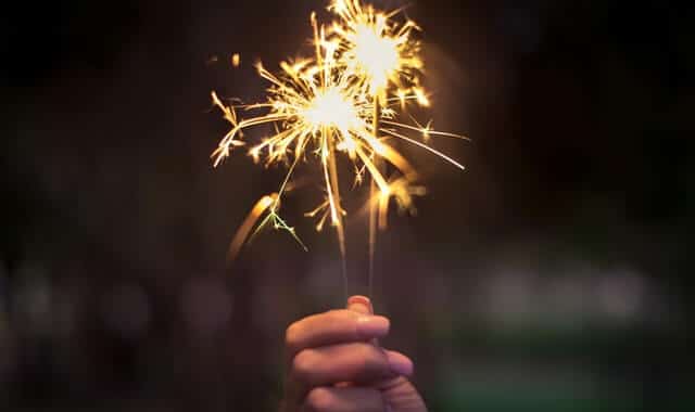 Hand holding sparklers