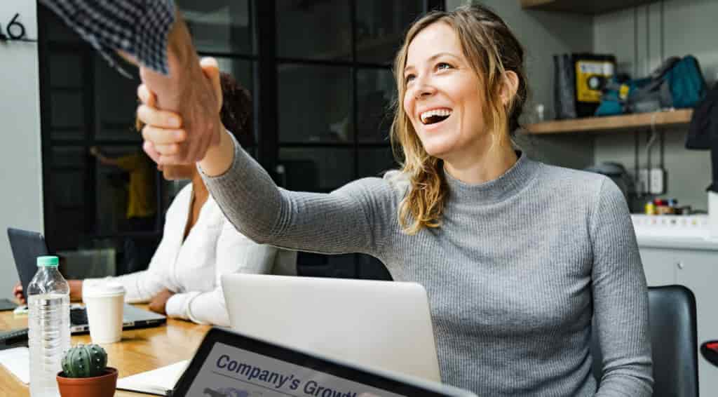 Professional women shaking hands with someone